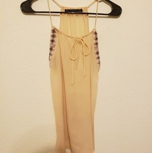 Beaded peach colored tank top.